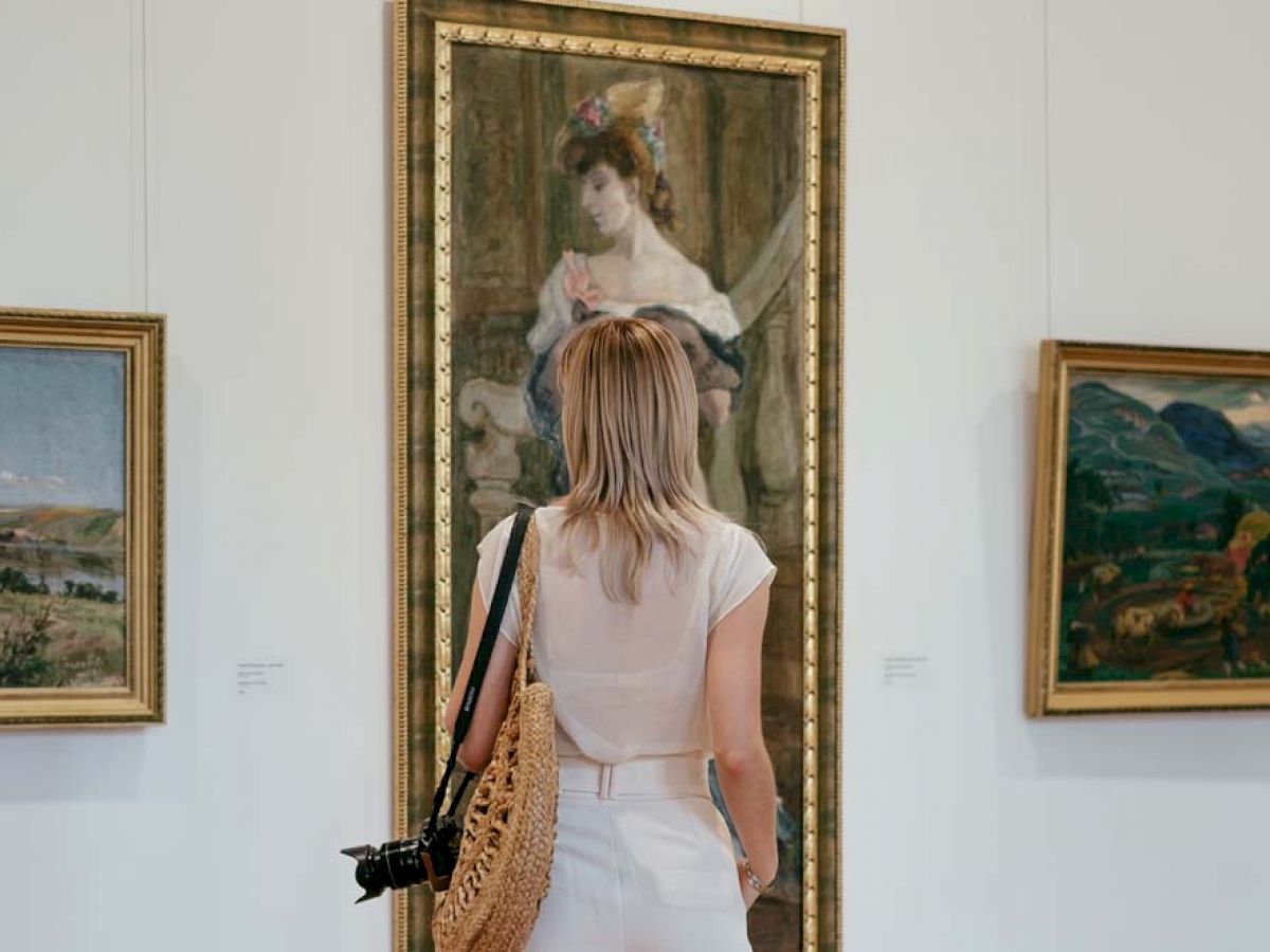 woman looking at painting