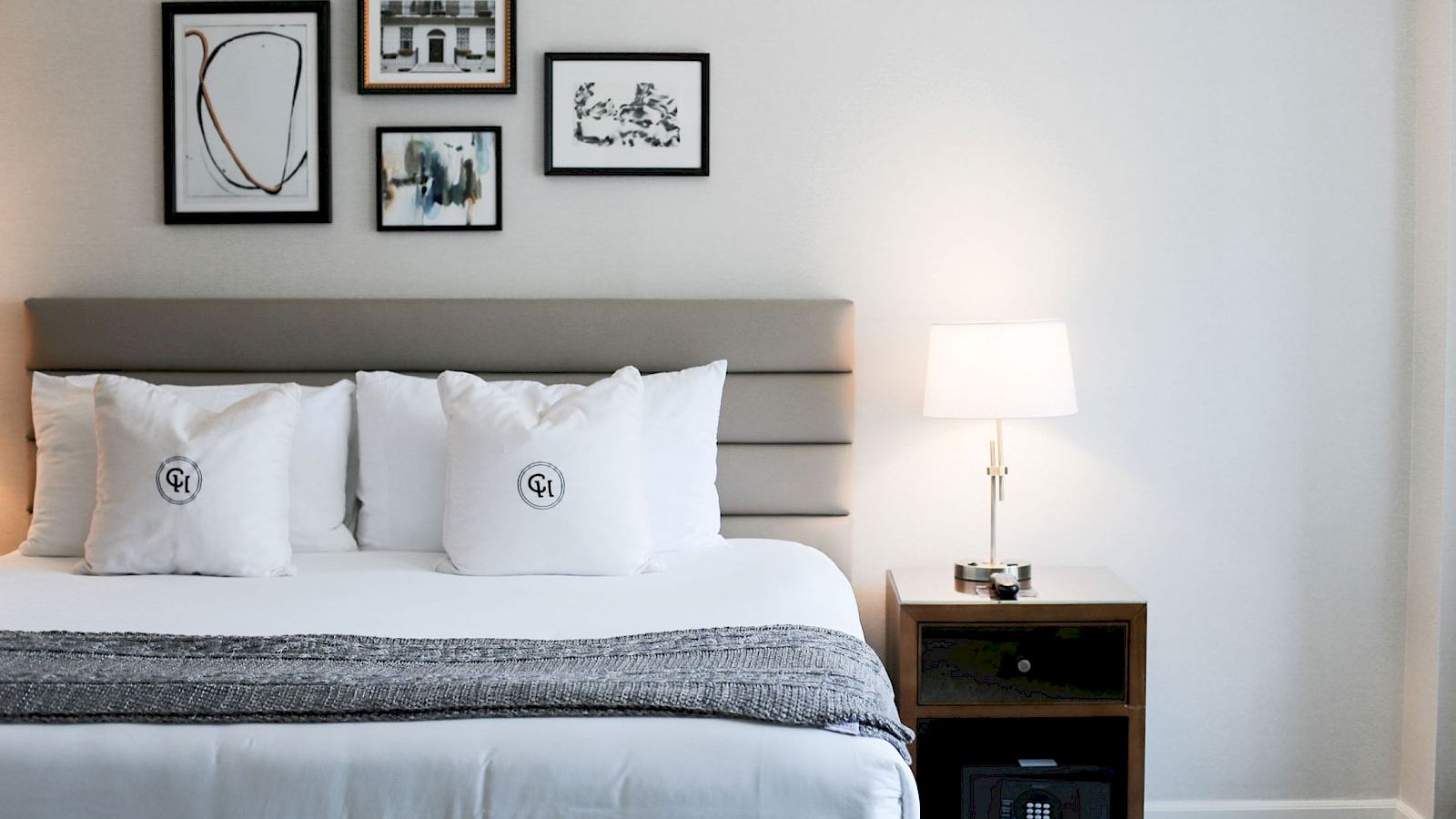 bed with paintings above