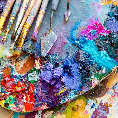 Paint and paintbrushes on a palette