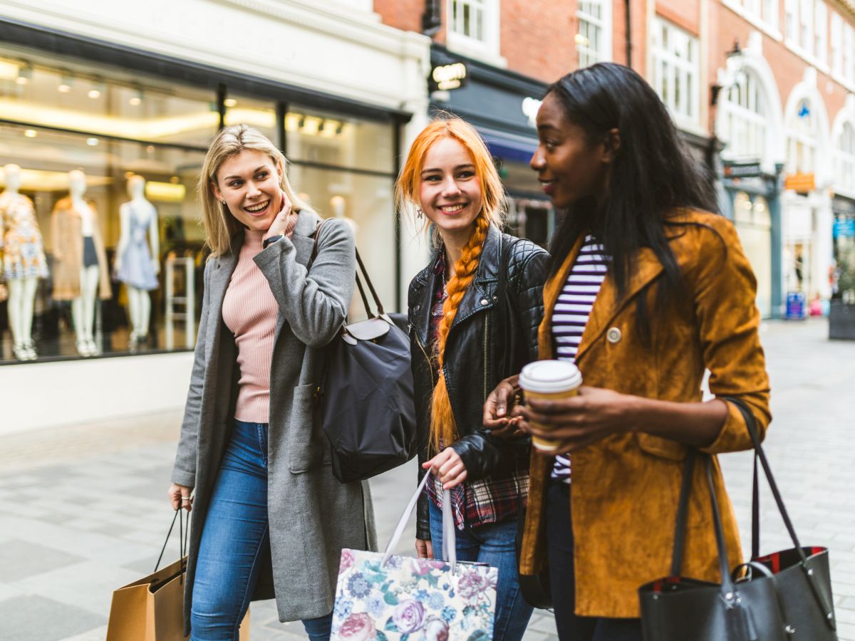 three women walking and talking